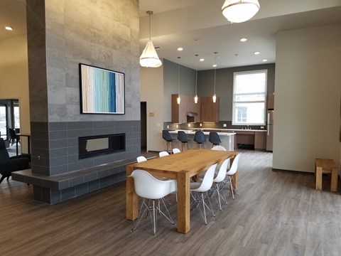 a dining room with a table and chairs and a fireplace